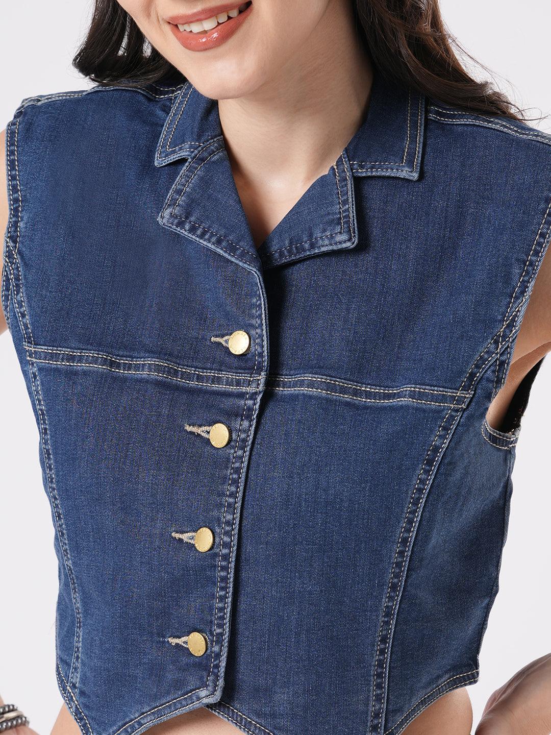 Woman wearing a denim vest by Reasa