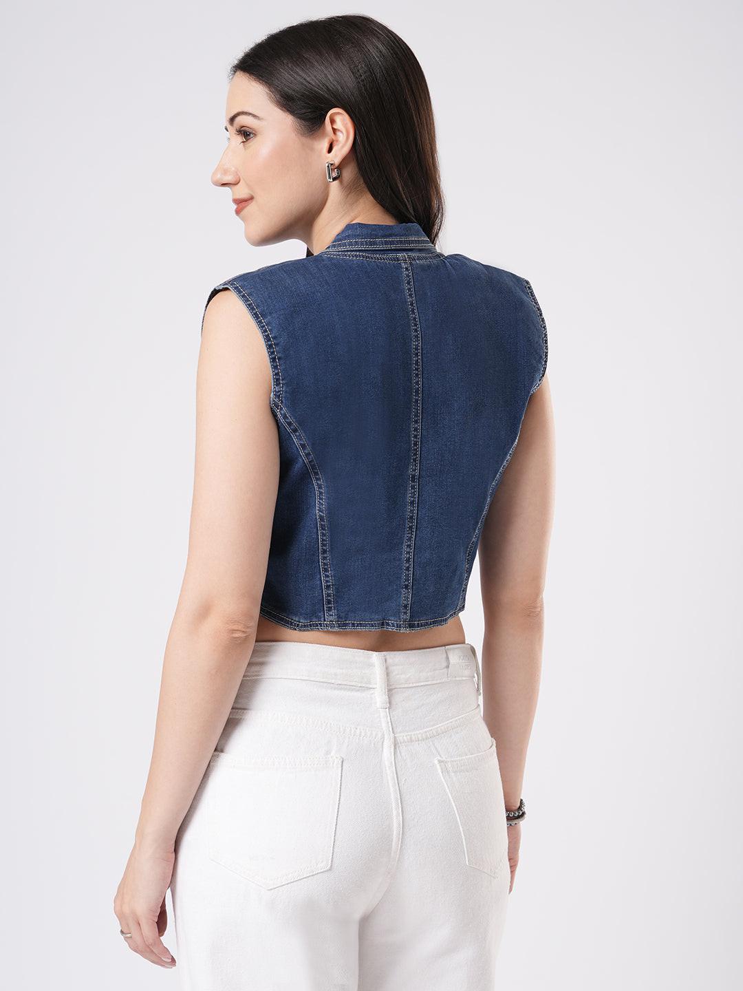Woman wearing a denim vest by Reasa