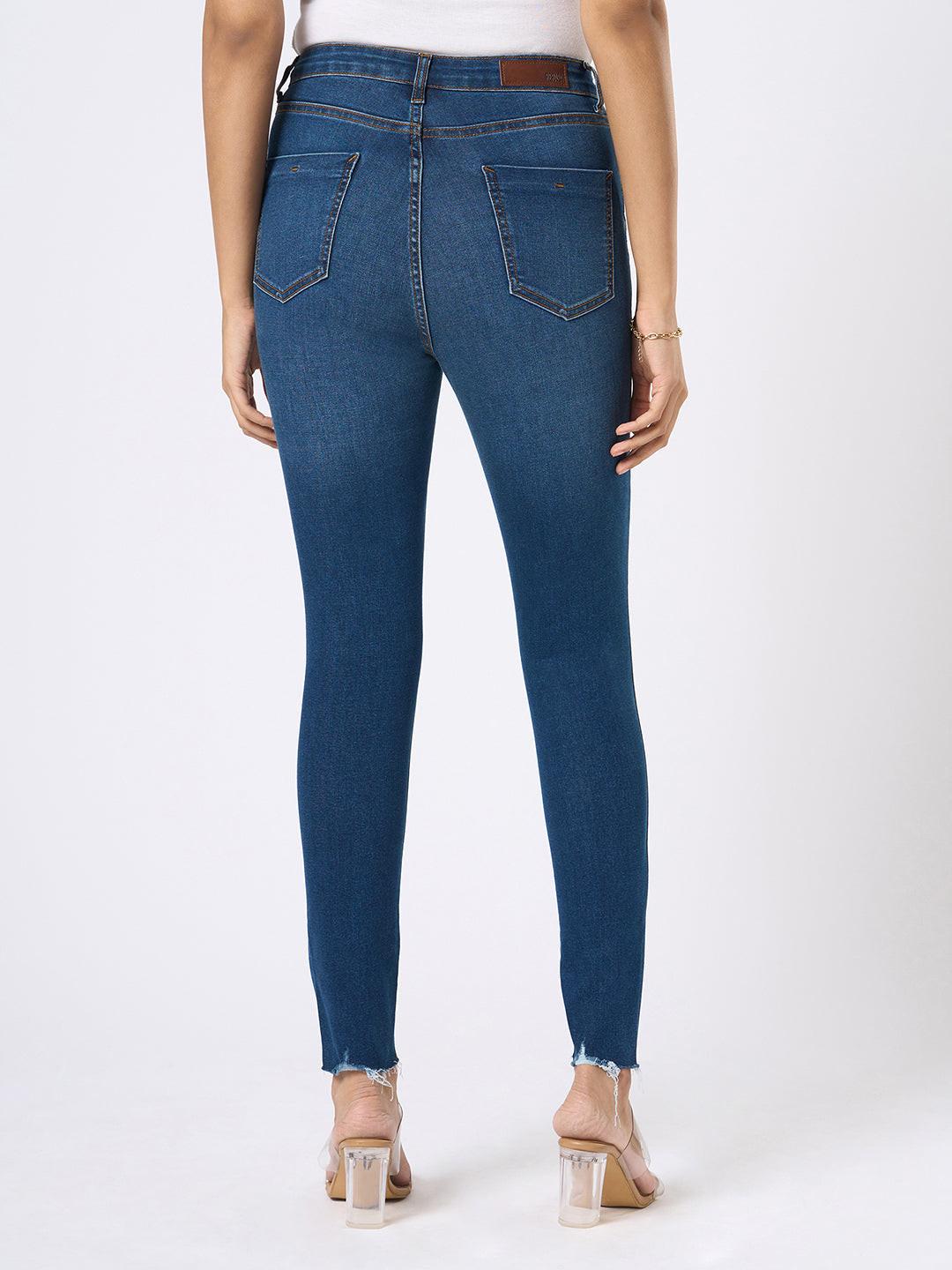 Rerasa Blue jeans worn by a person on a white background