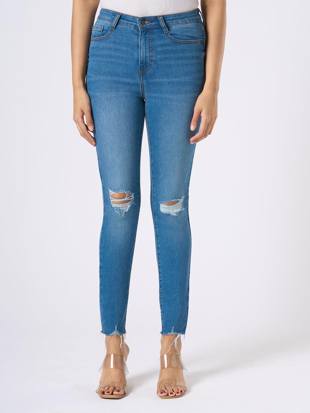 Rerasa Blue jeans with slight distressing on a white background