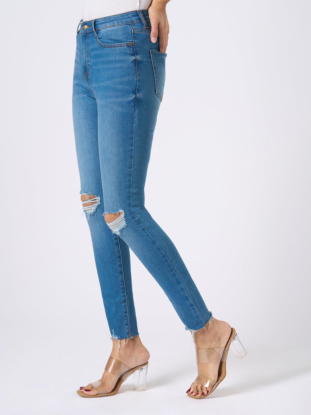 Rerasa Blue jeans with slight distressing on a white background