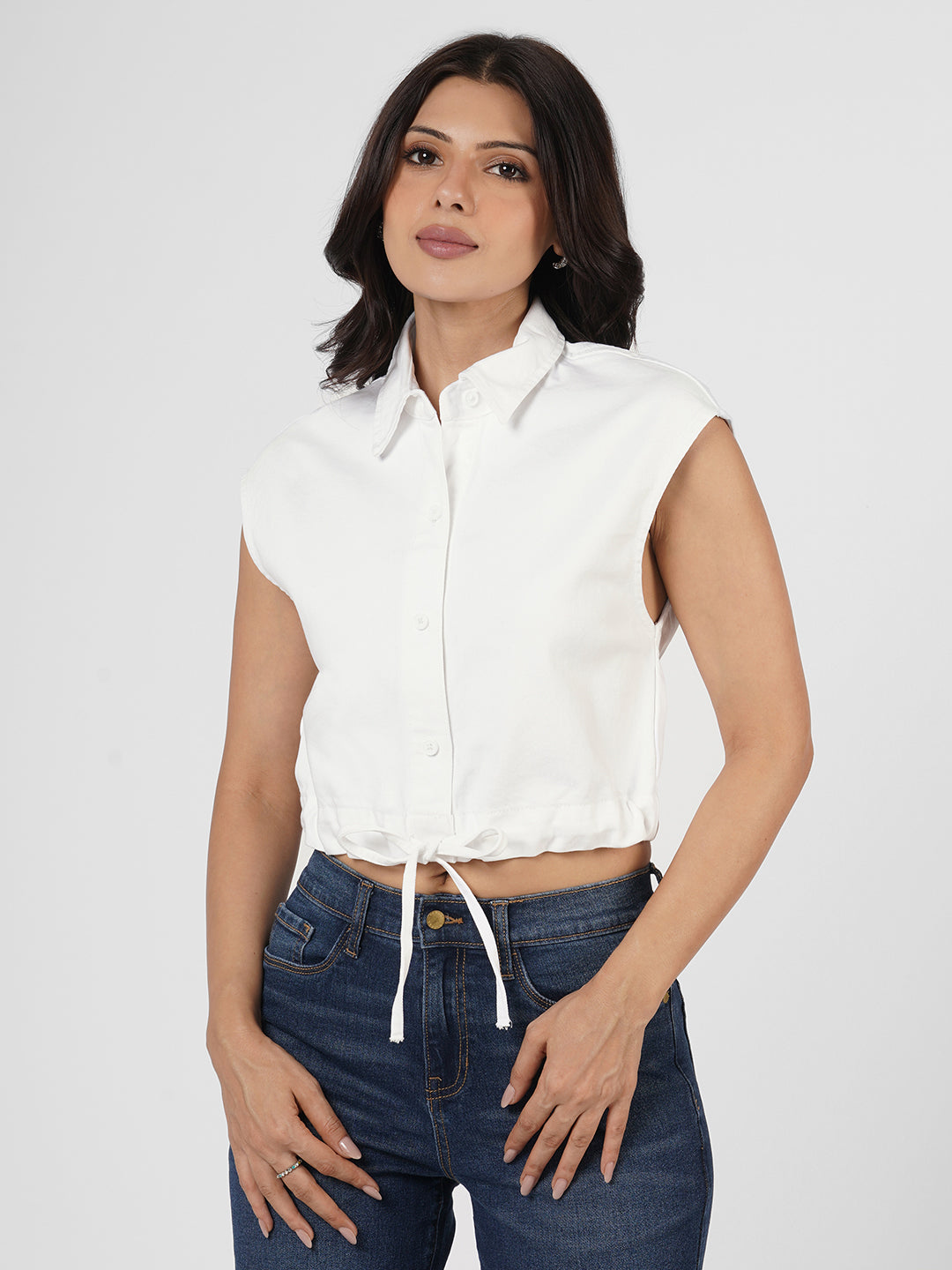 Woman wearing a white cap sleeves top by Rerasa