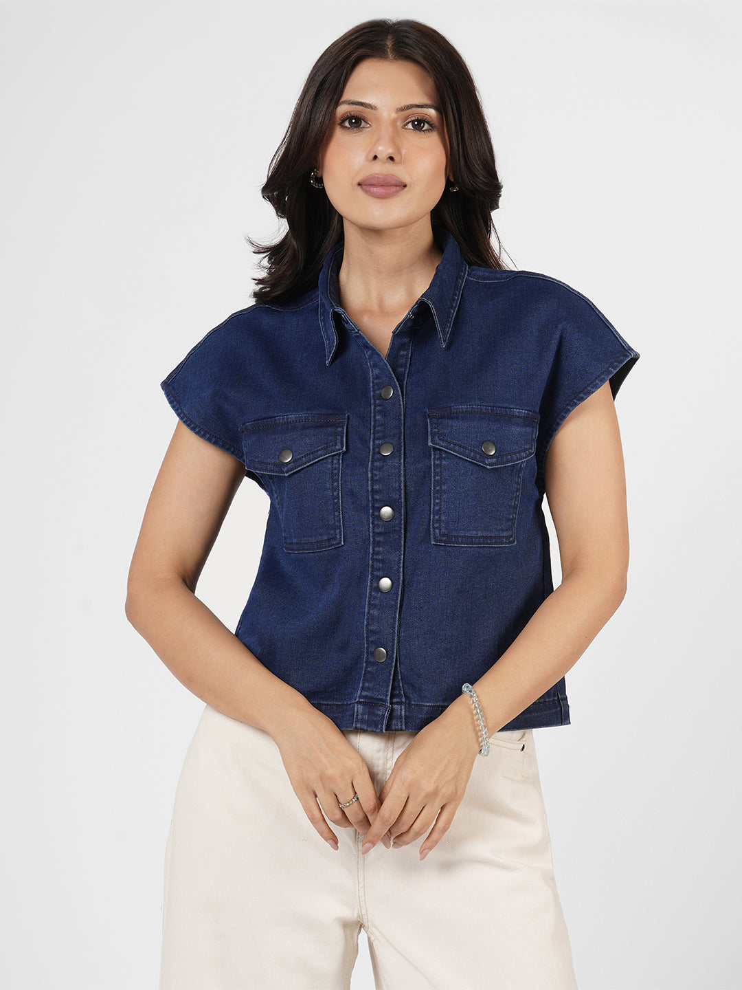 Woman wearing a blue denim shirt by Rerasa