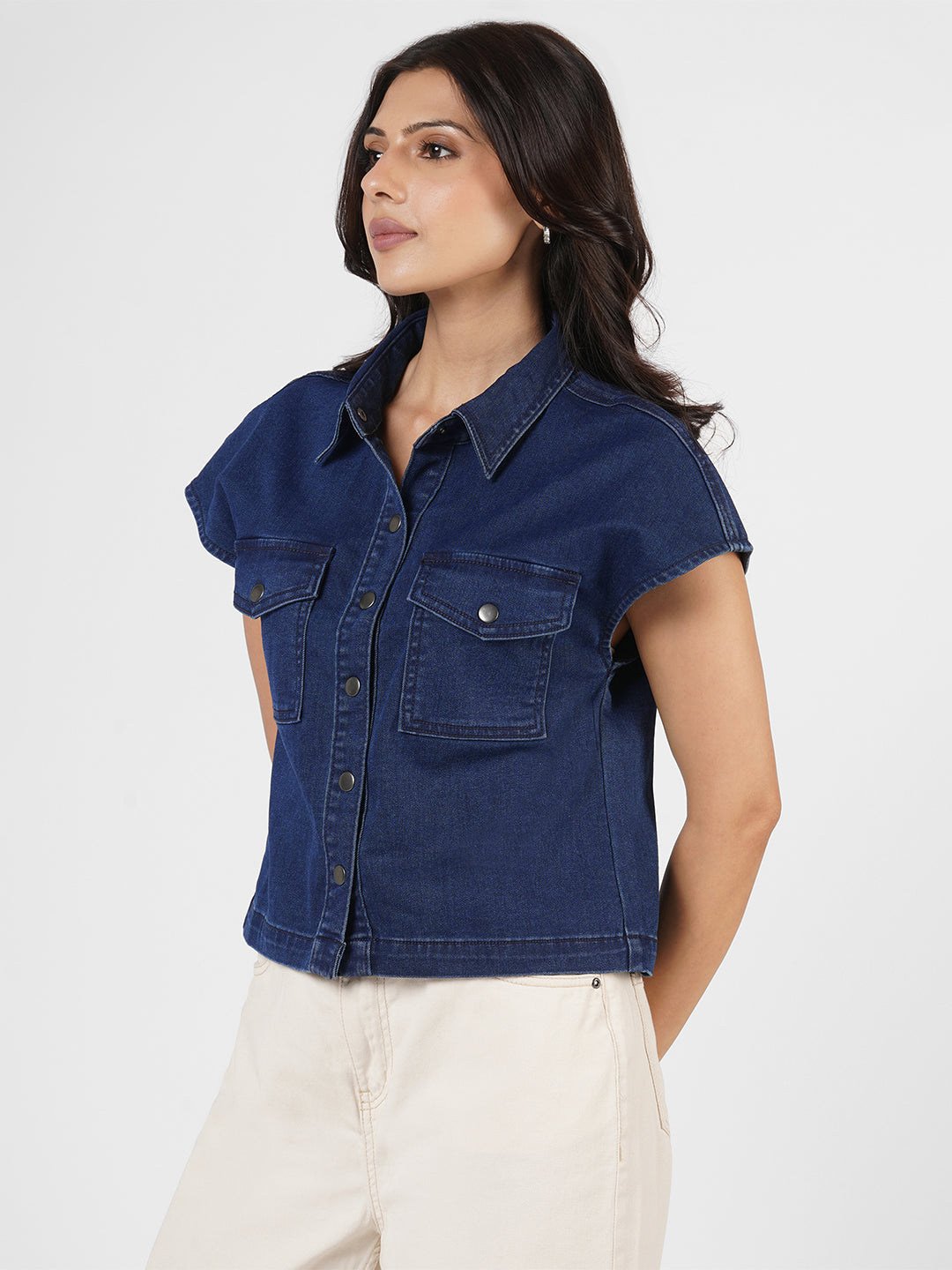 Woman wearing a blue denim shirt by Rerasa
