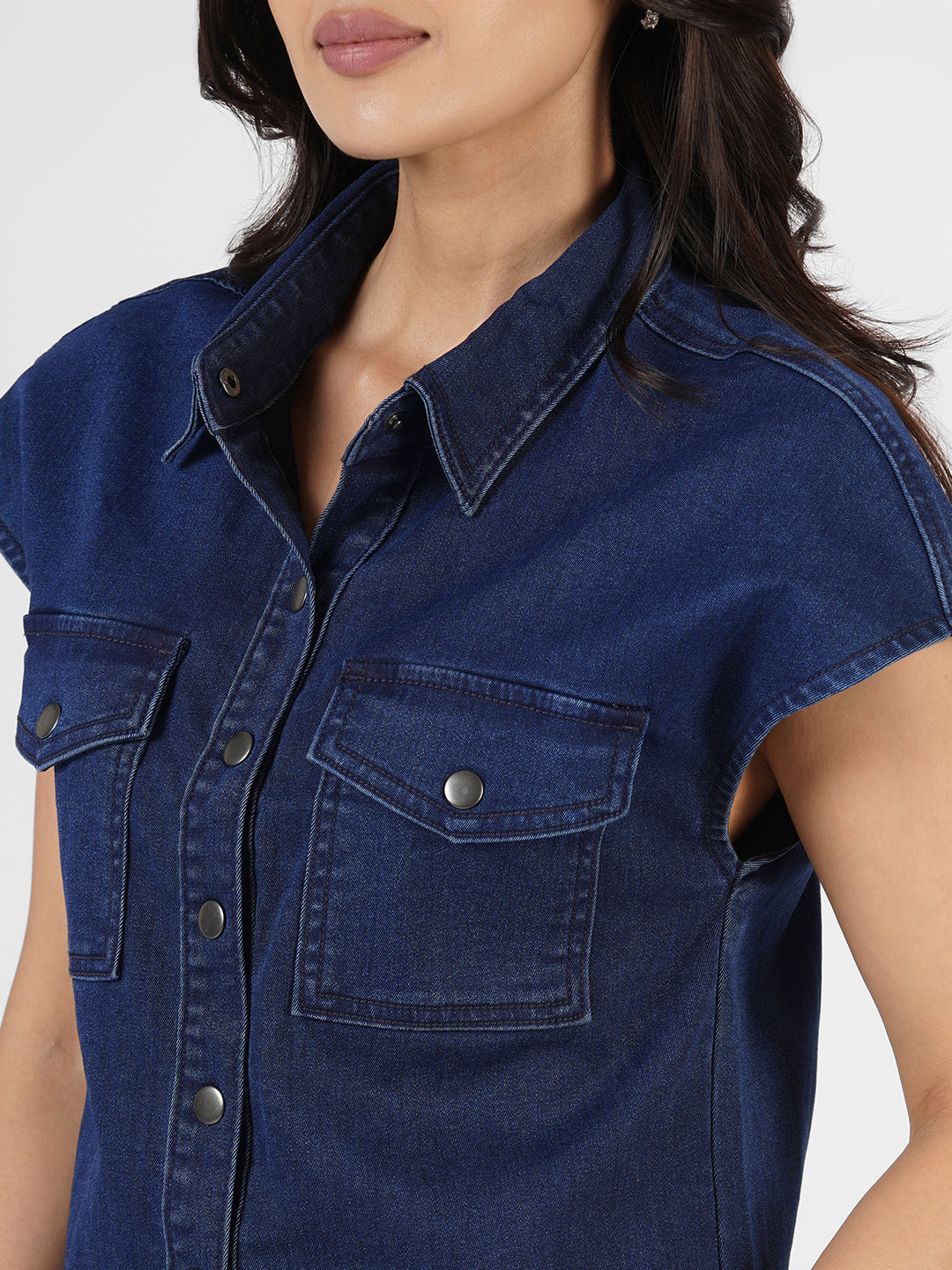 Woman wearing a blue denim shirt by Rerasa