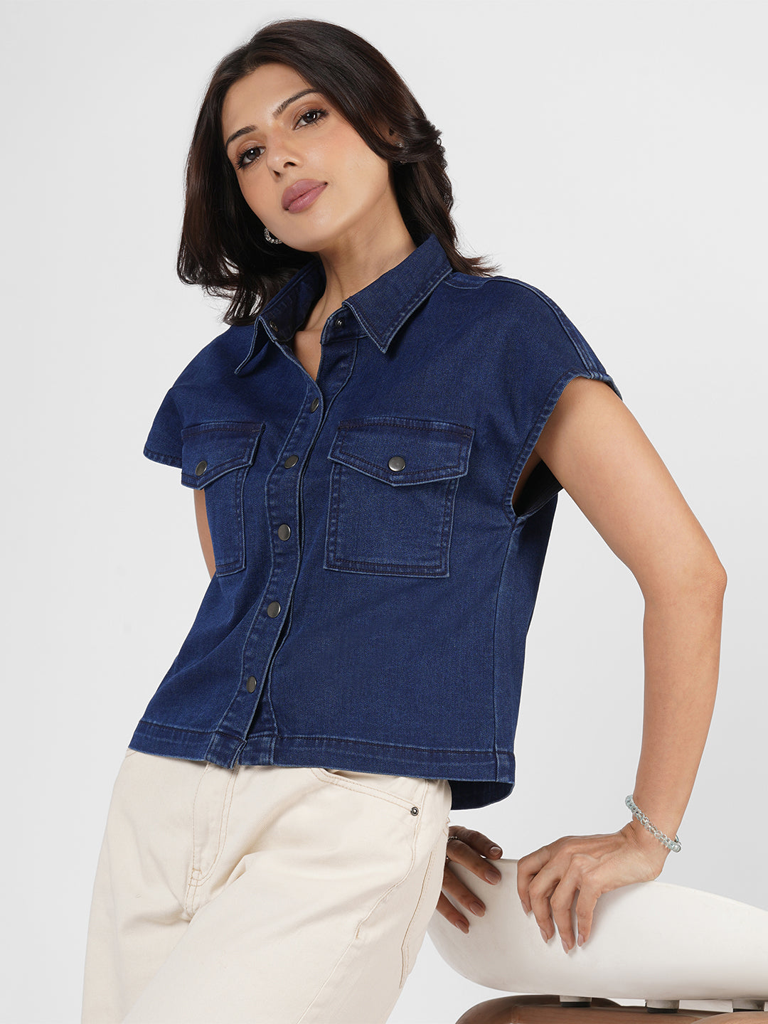 Woman wearing a blue denim shirt by Rerasa