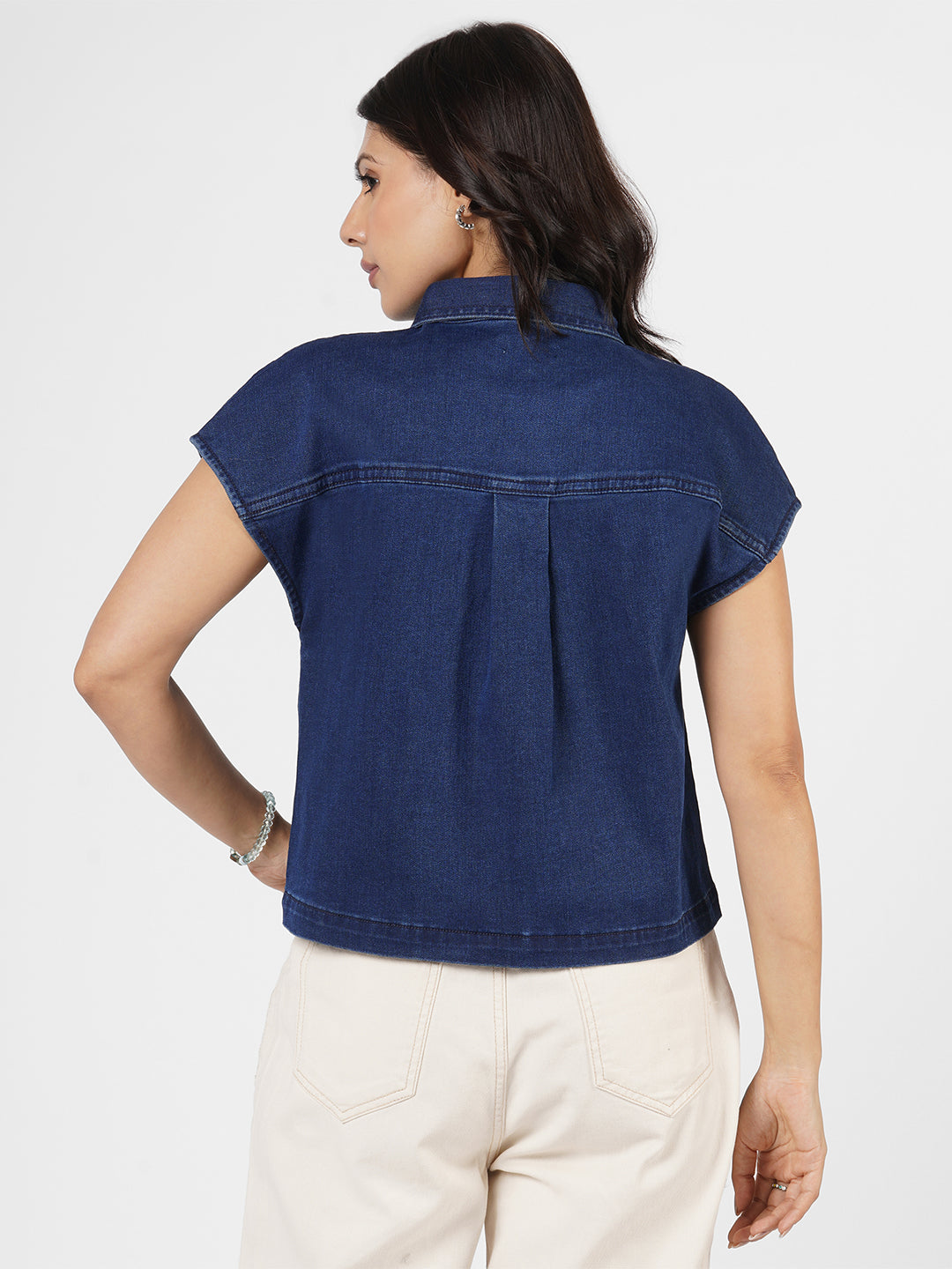 Woman wearing a blue denim shirt by Rerasa