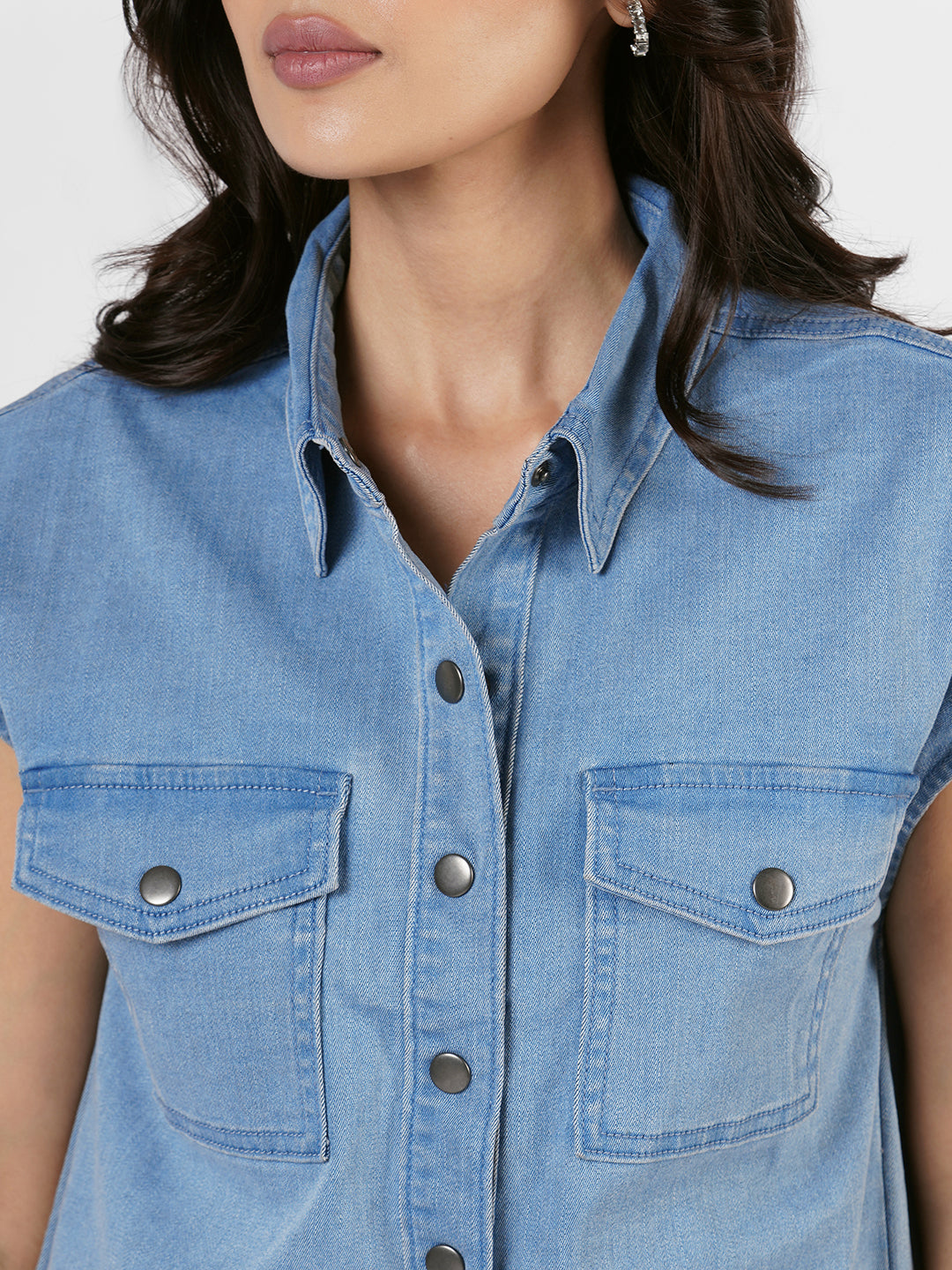 Woman wearing a blue denim shirt by Rerasa