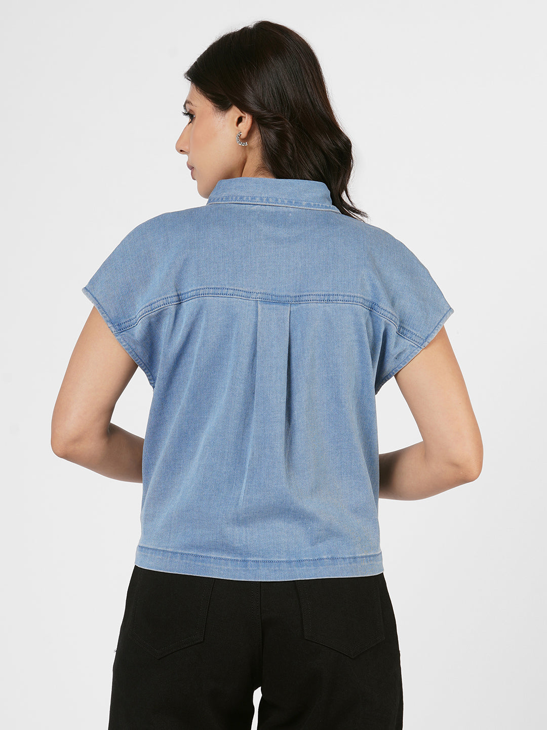 Woman wearing a blue denim shirt by Rerasa