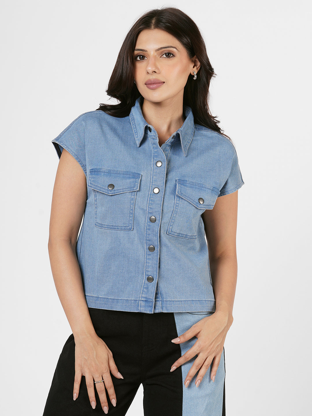 Woman wearing a blue denim shirt by Rerasa