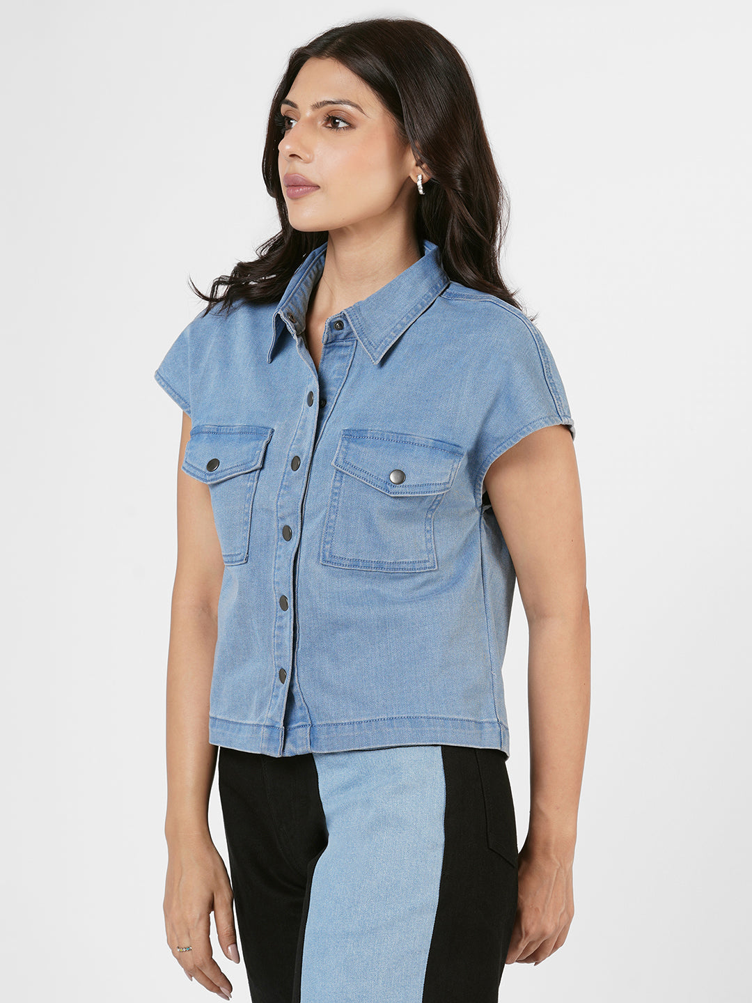 Woman wearing a blue denim shirt by Rerasa