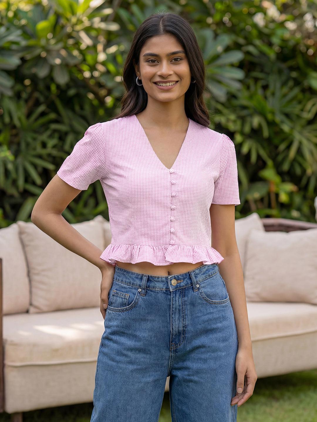 Woman wearing a pink crop top by Rerasa