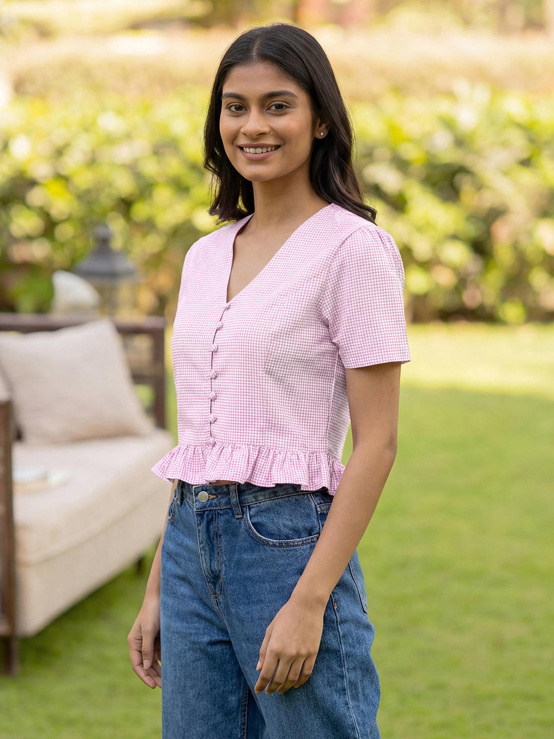 Woman wearing a pink crop top by Rerasa