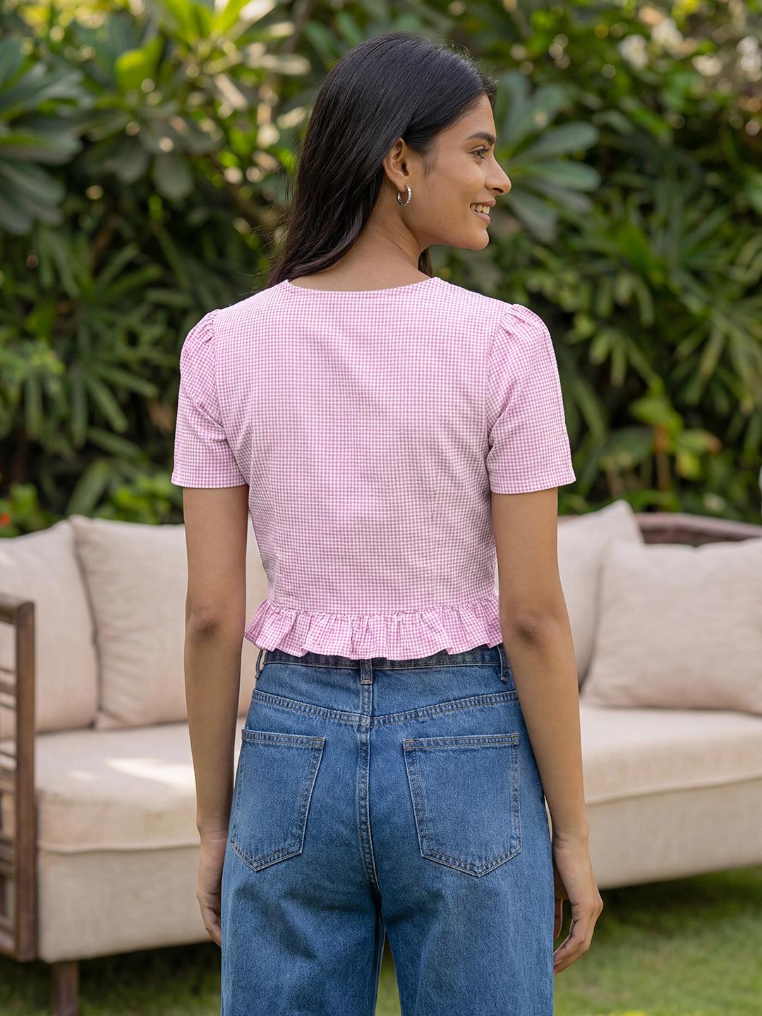 Woman wearing a pink crop top by Rerasa