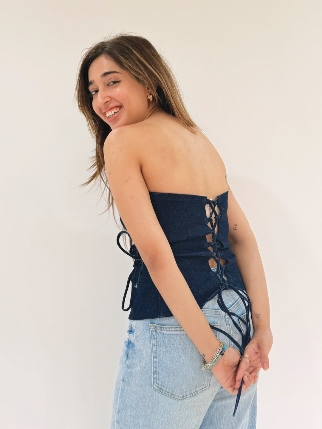 Woman in a blue strapless top by Rerasa
