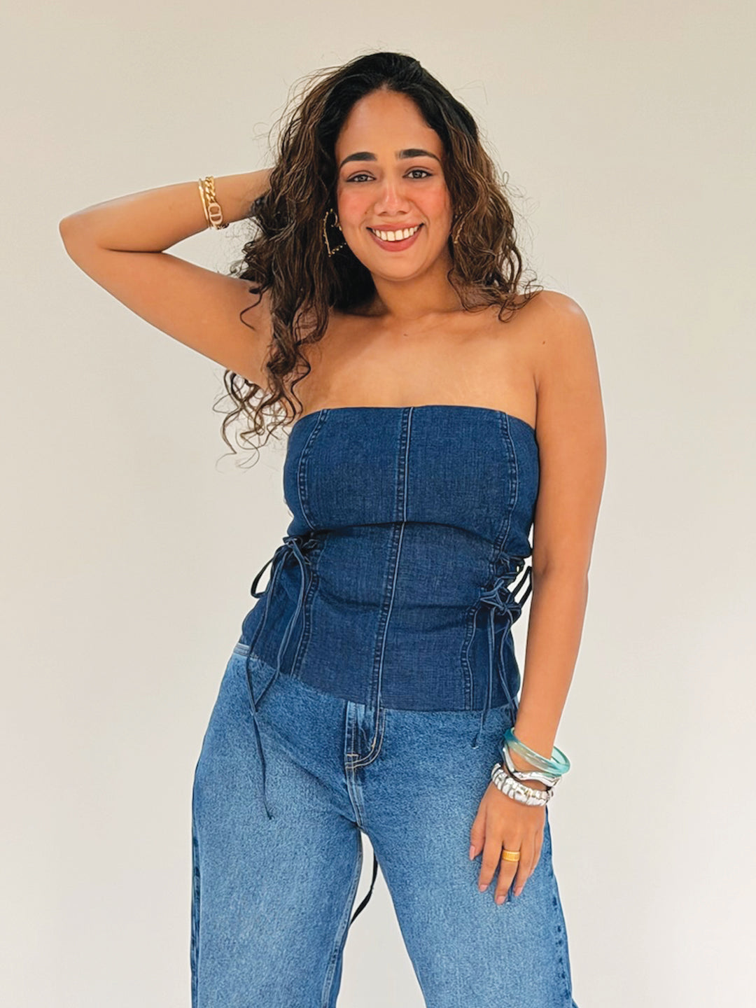 Woman in a blue strapless top by Rerasa