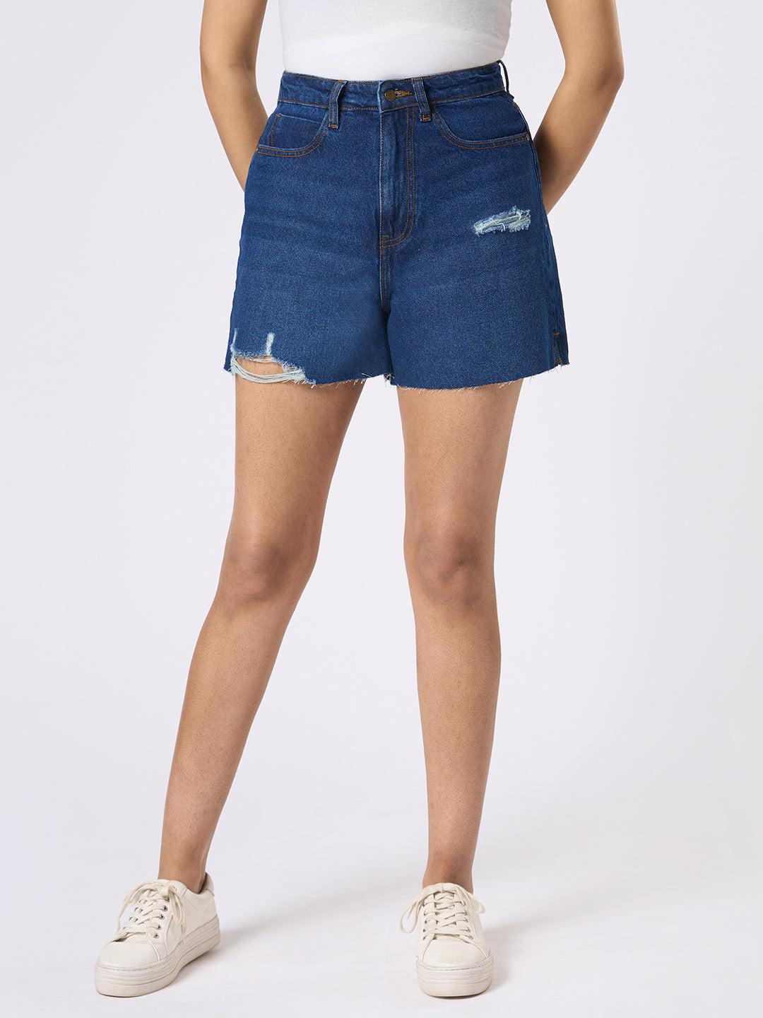 Person wearing blue denim shorts by Rerasa