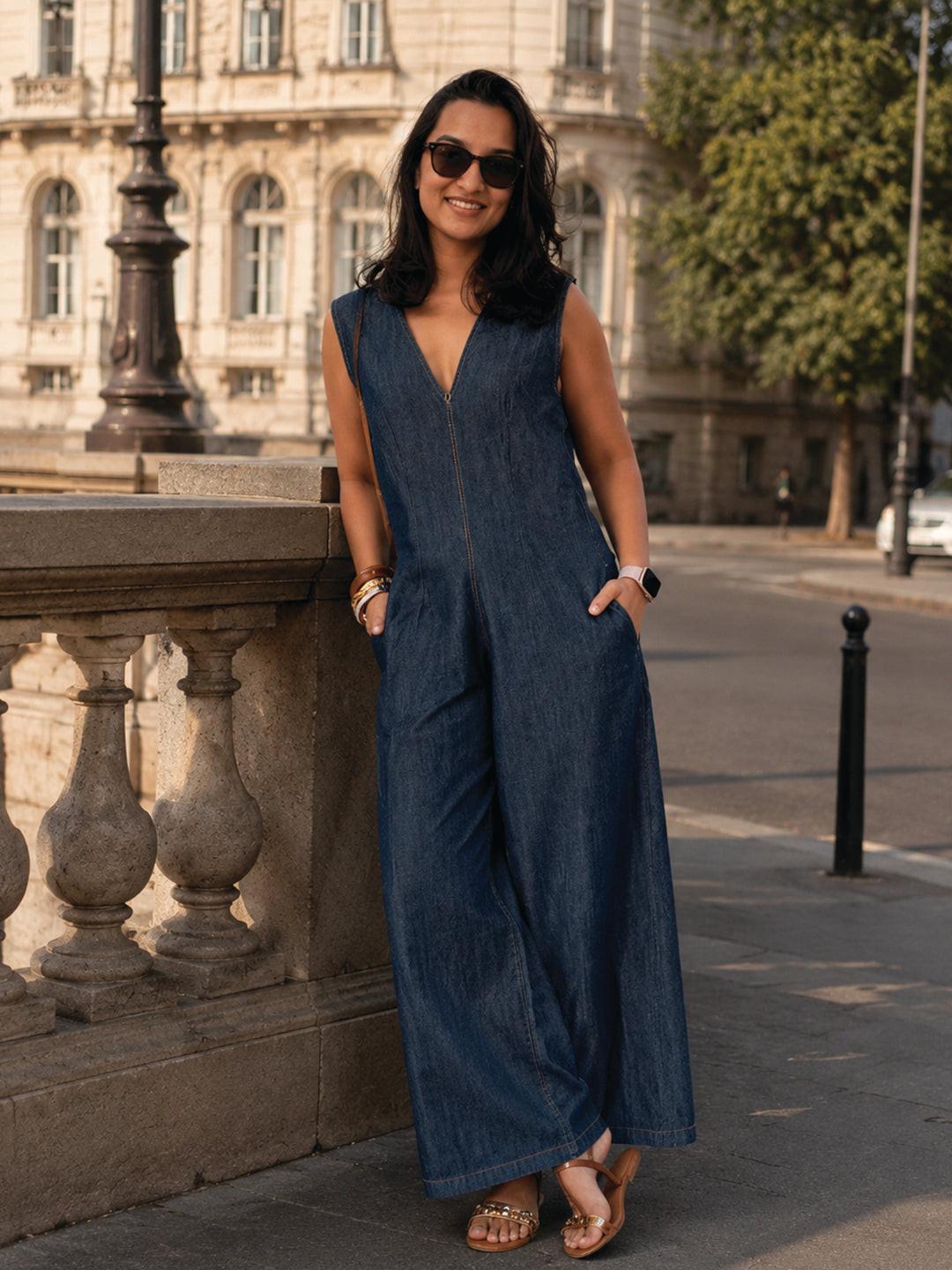 Woman wearing a blue denim jumpsuit  by Rerasa