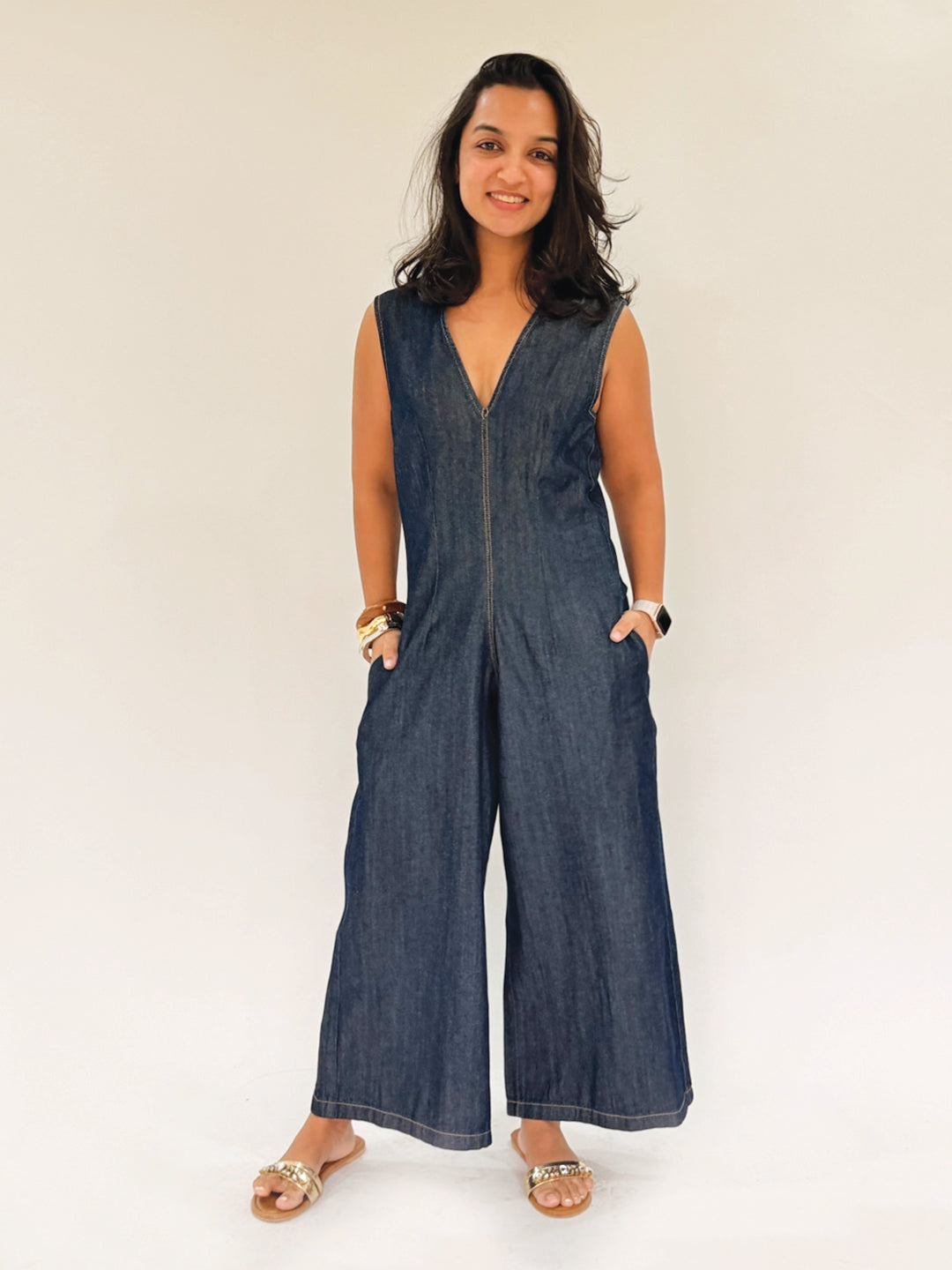 Woman wearing a blue denim jumpsuit  by Rerasa