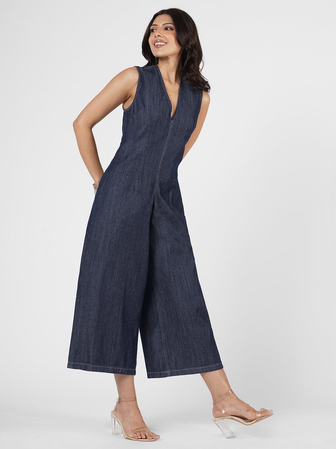 Woman wearing a blue denim jumpsuit  by Rerasa