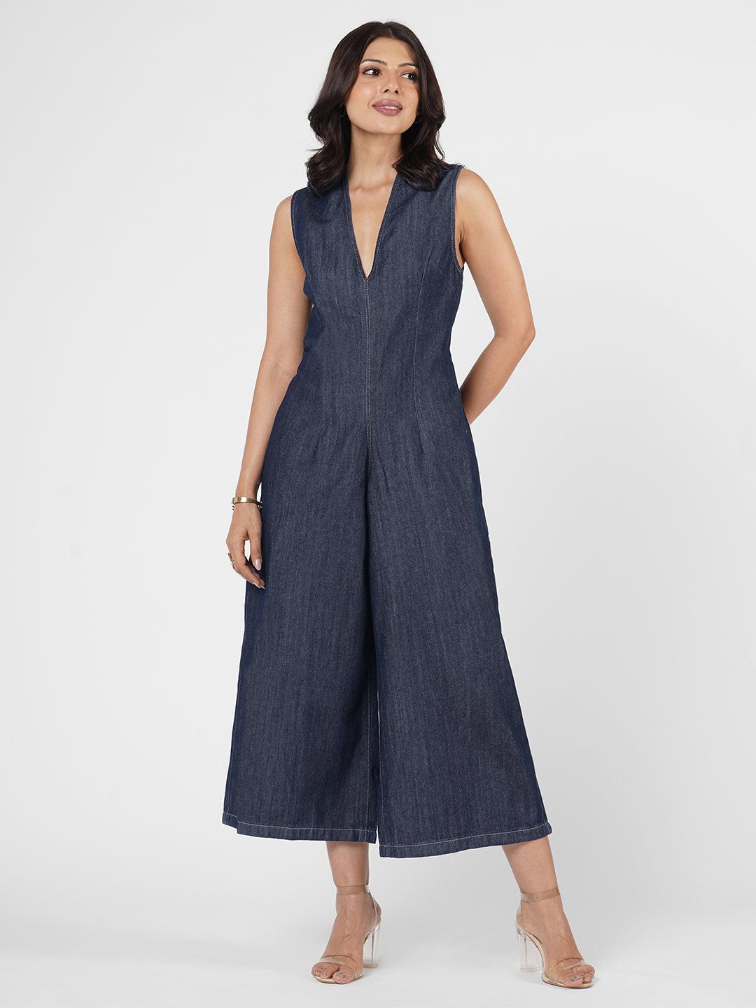 Woman wearing a blue denim jumpsuit  by Rerasa