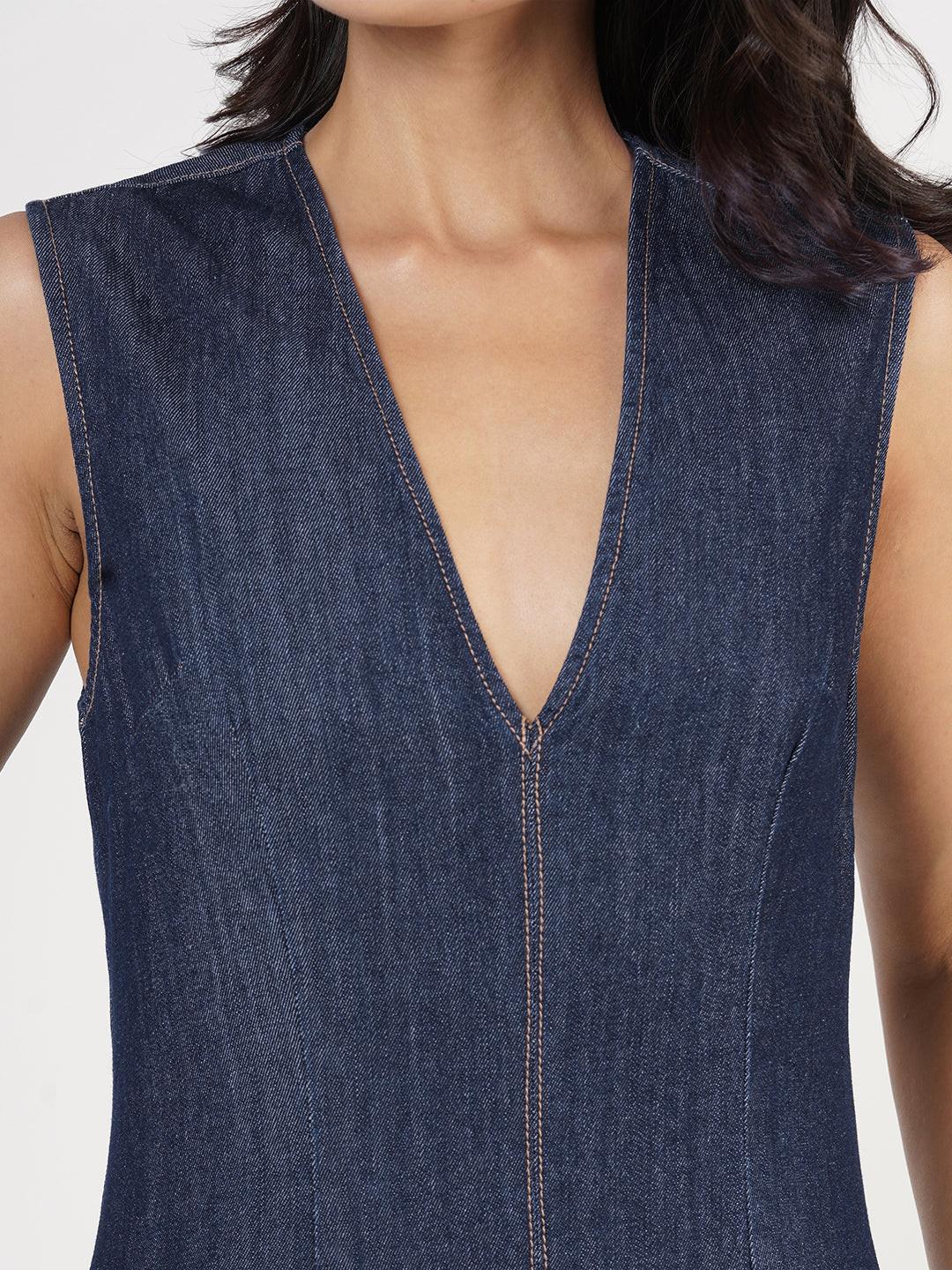 Woman wearing a blue denim jumpsuit  by Rerasa