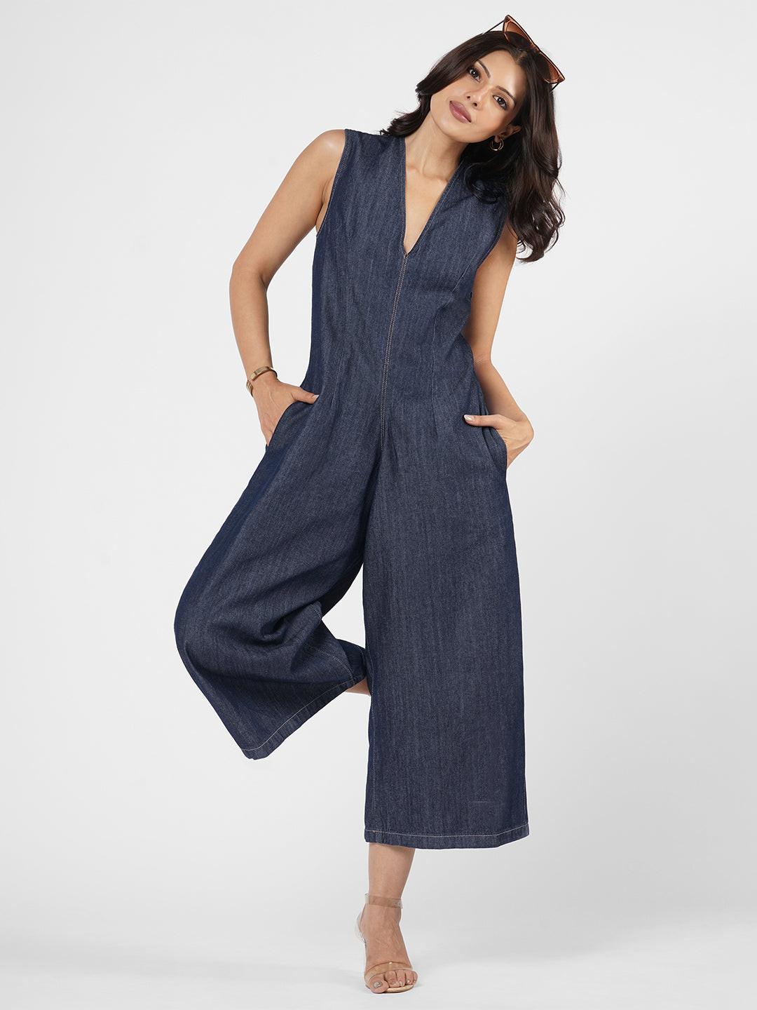 Woman wearing a blue denim jumpsuit  by Rerasa