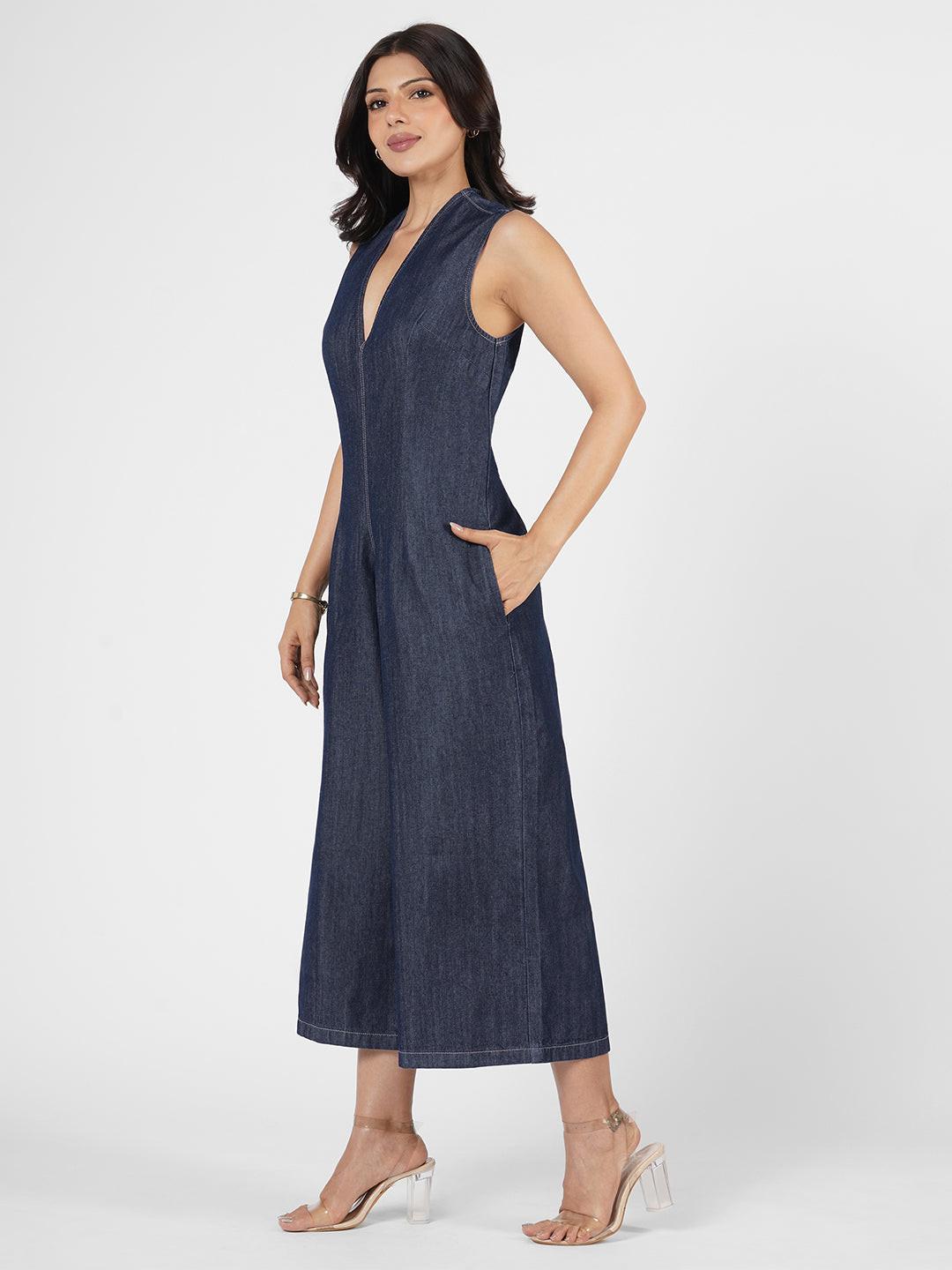 Woman wearing a blue denim jumpsuit  by Rerasa