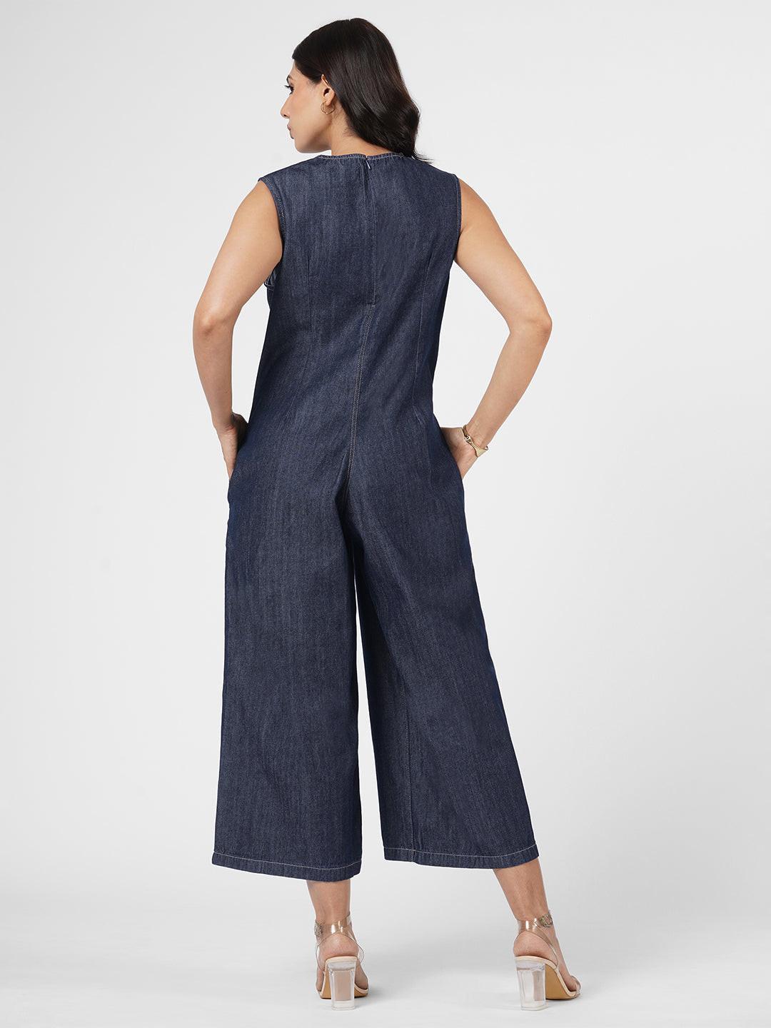 Woman wearing a blue denim jumpsuit  by Rerasa