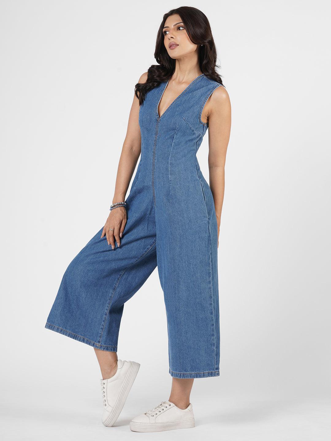 Woman wearing a blue denim jumpsuit  by Rerasa