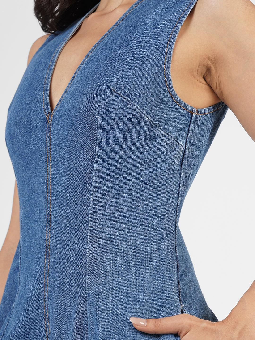 Woman wearing a blue denim jumpsuit  by Rerasa