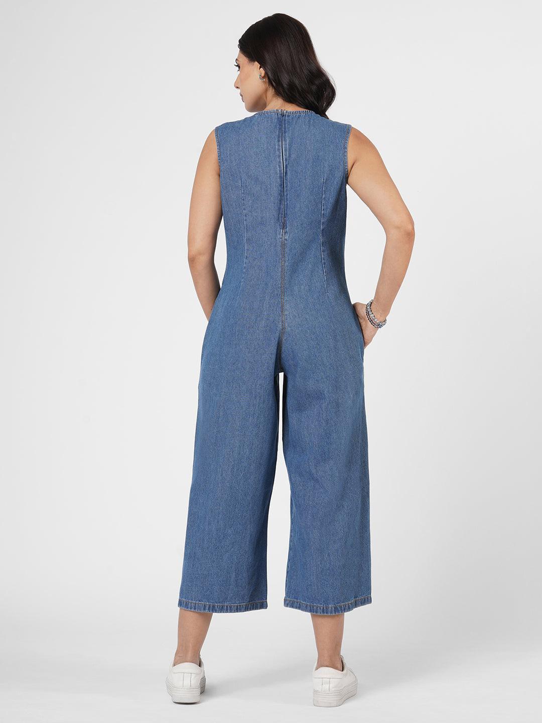 Woman wearing a blue denim jumpsuit  by Rerasa