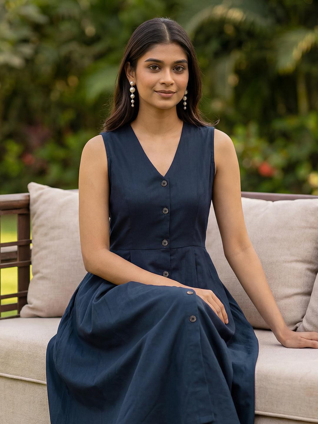 Woman wearing a navy dress by Rerasa