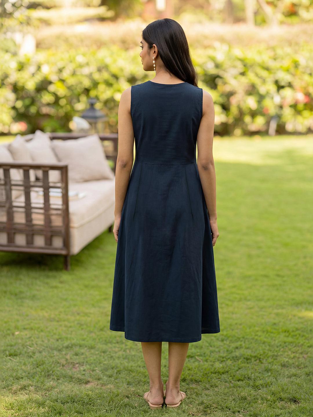 Woman wearing a navy dress by Rerasa