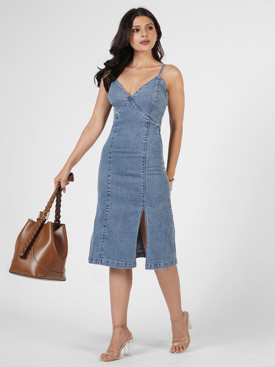 Woman wearing a indigo spaghetti denim dress 