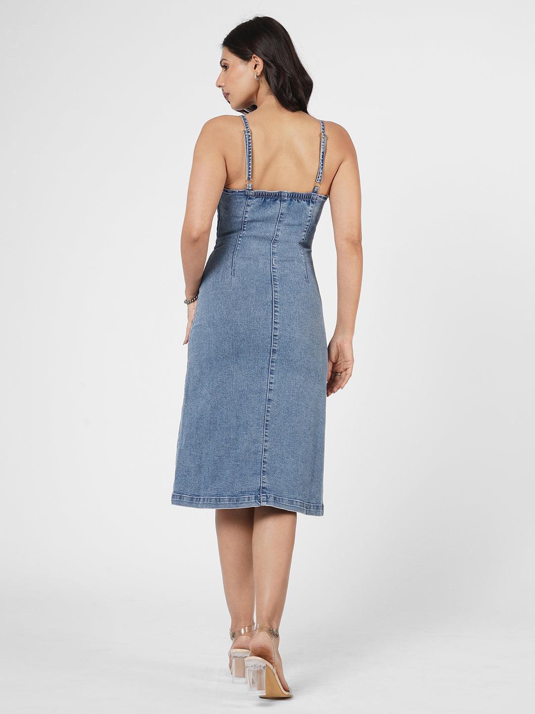 Woman wearing a indigo spaghetti denim dress 