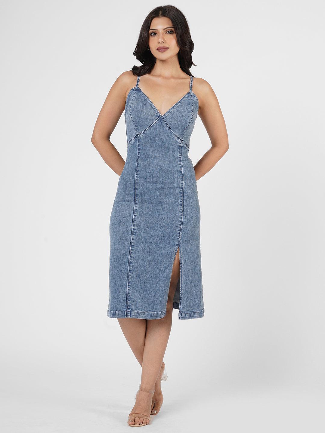 Woman wearing a indigo spaghetti denim dress 