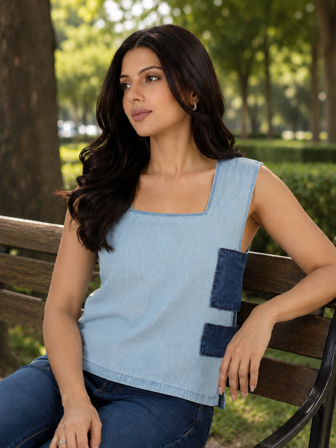 Woman wearing a blue sleeveless top by Rerasa