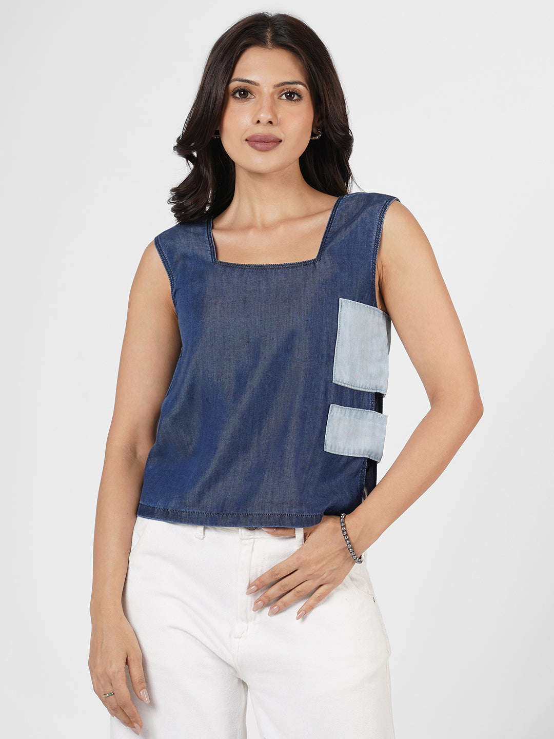 Woman wearing a blue sleeveless top by Rerasa