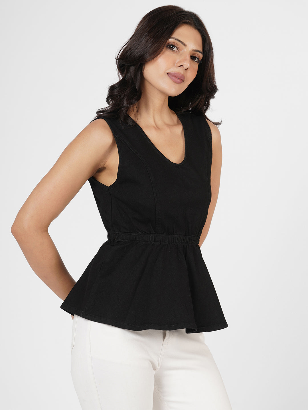 Woman wearing Structured Denim Peplum Top by Rerasa