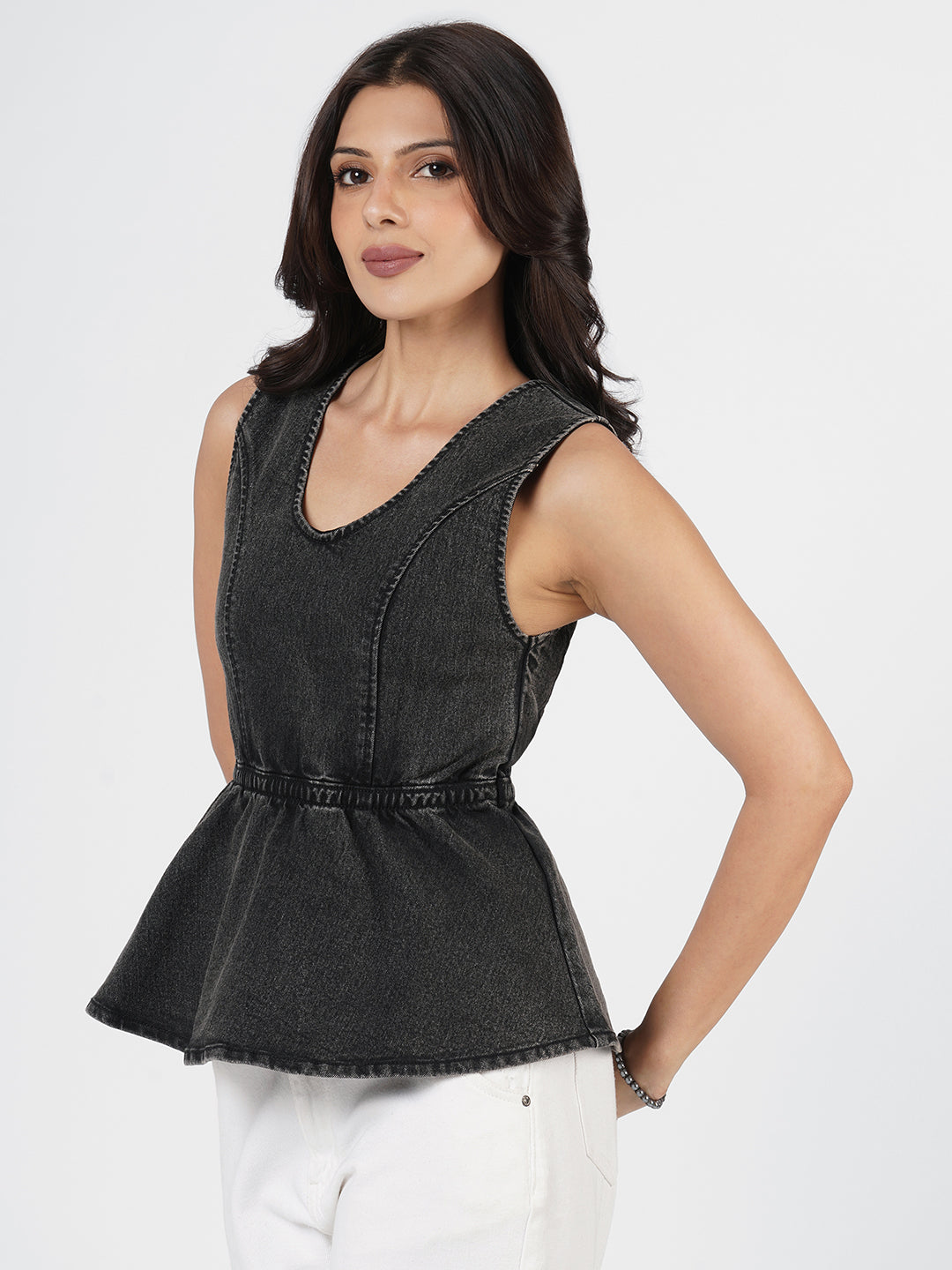 Woman wearing Structured Denim Peplum Top by Rerasa