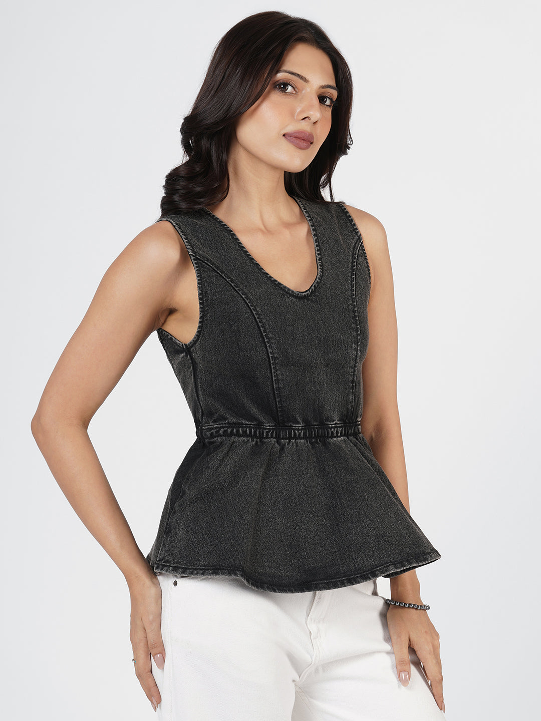 Woman wearing Structured Denim Peplum Top by Rerasa