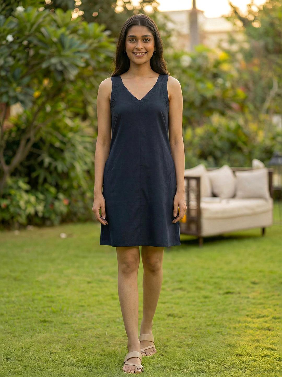 Woman wearing  Rerasa's navy dress 
