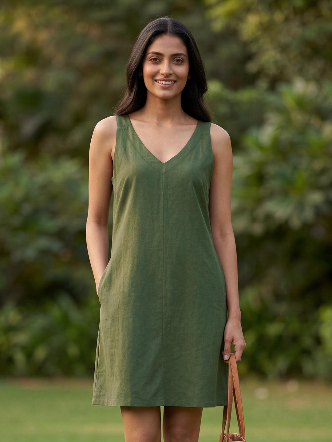 Woman wearing  Rerasa's green dress 